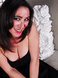 Naughty American mom masturbating on the couch