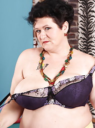 Huge breasted mature lady playing with herself