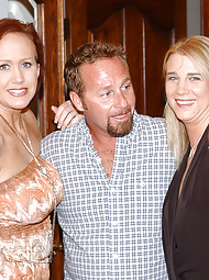 A sexy milf duo gets dowsed with cum and then swaps it in their mouths