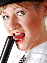 Horny policewoman plunges a billy club in her fuck box before she takes off her undies