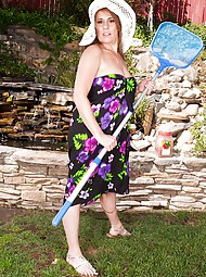 Cristine Ruby masturbates her older pussy outdoors.