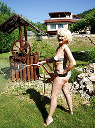 Naughty mature lady getting frisky in her garden